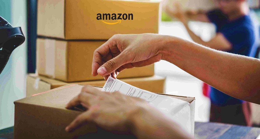 Hands meticulously affixing a shipping label to a cardboard box