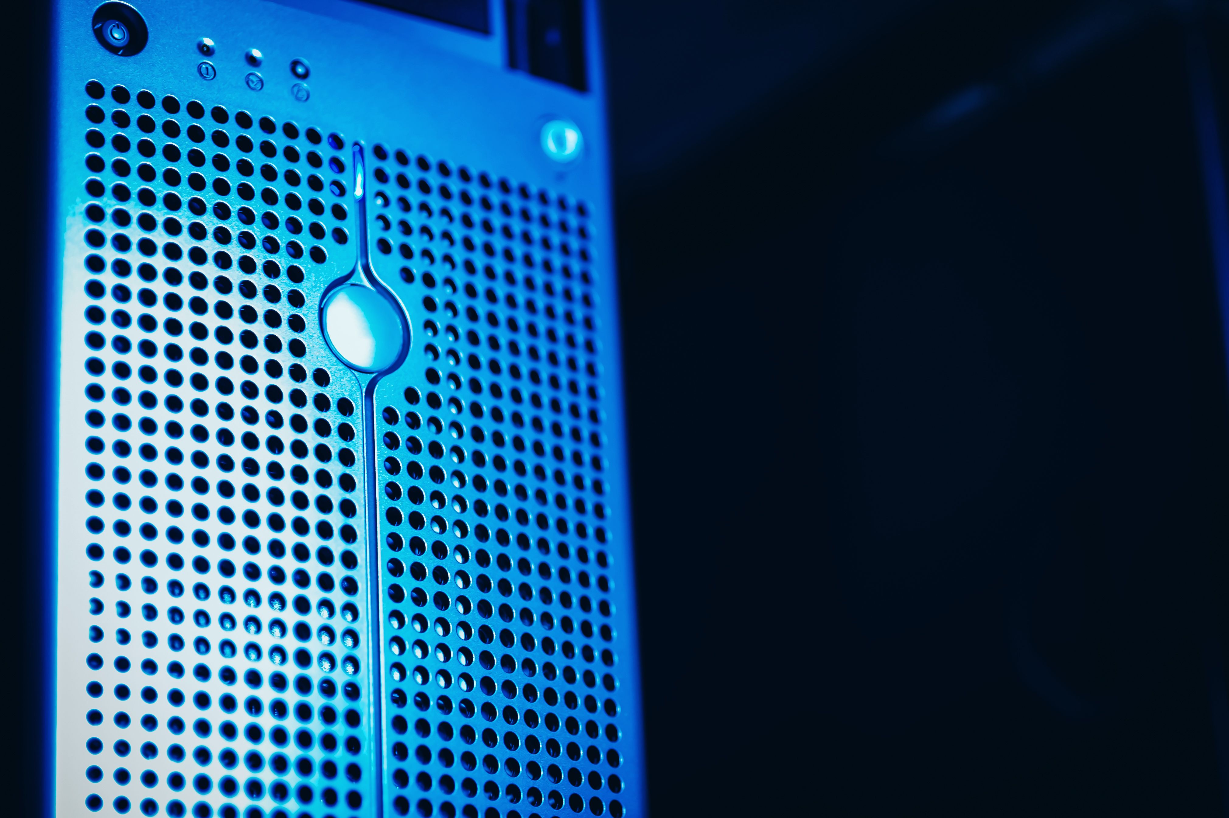 Blue-lit server rack in a secure data center, representing investment in resilient business infrastructure.